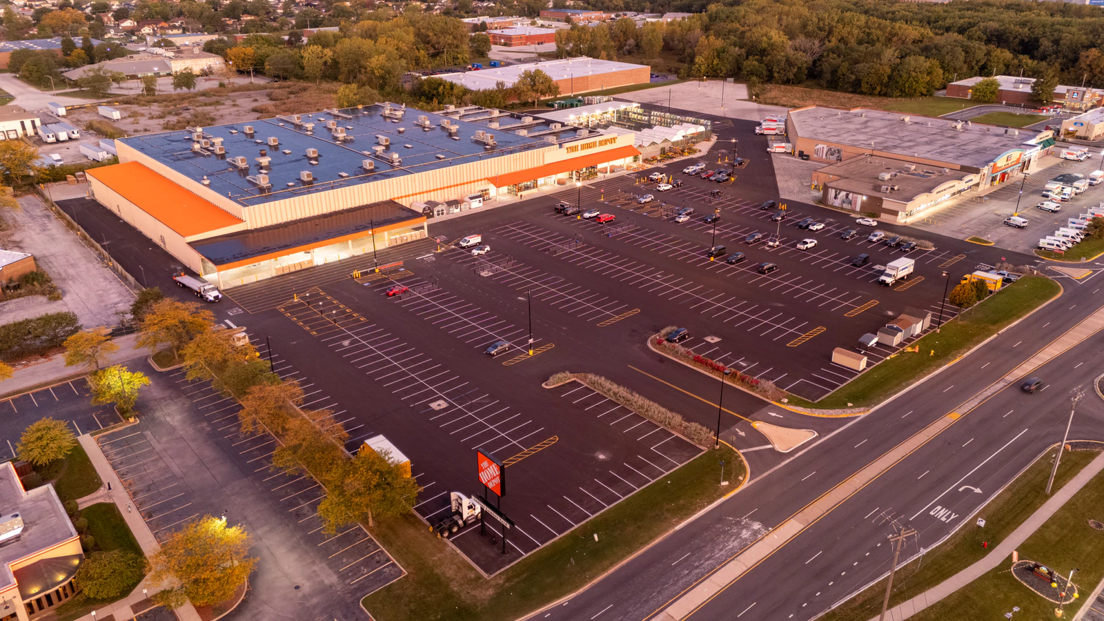 Dawn aerial view of Home Depot parking lots repaved and striped by Advantage Paving