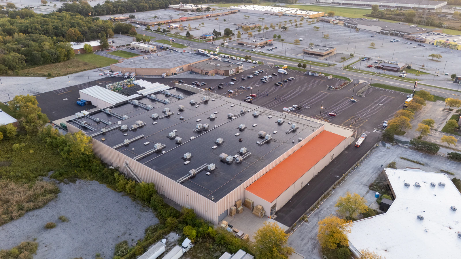 Dawn aerial view of Home Depot parking lots repaved and striped by Advantage Paving