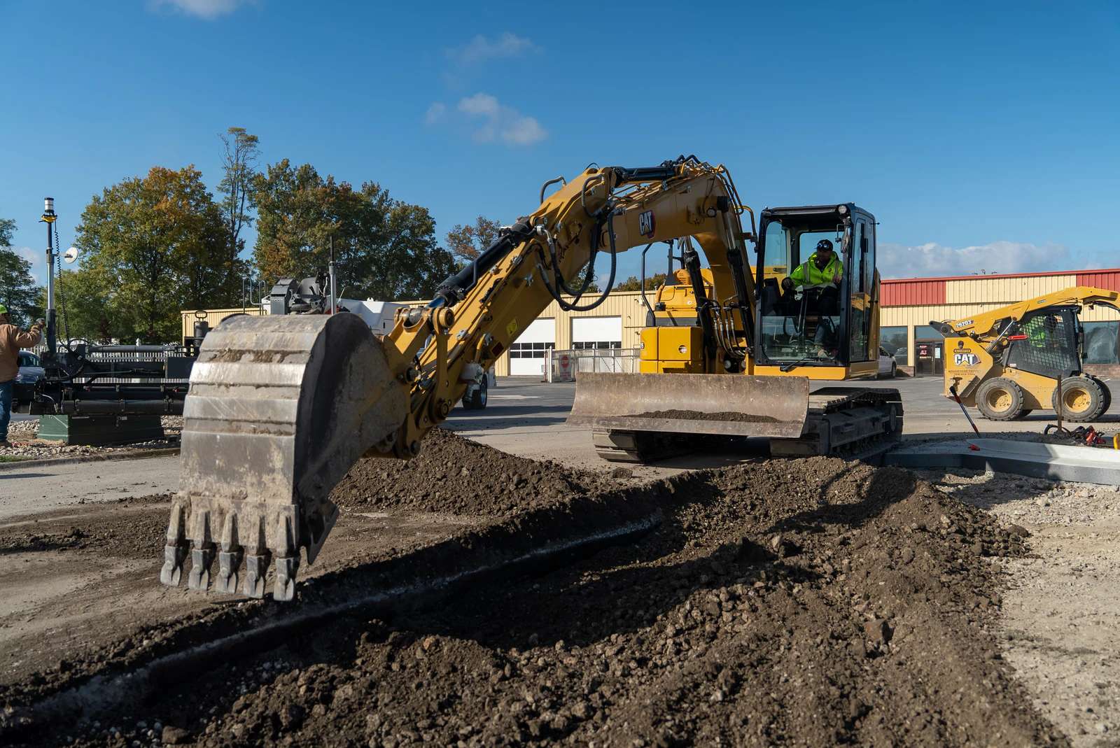 Advantage Paving excavator loading broken concrete during site excavation and preparation